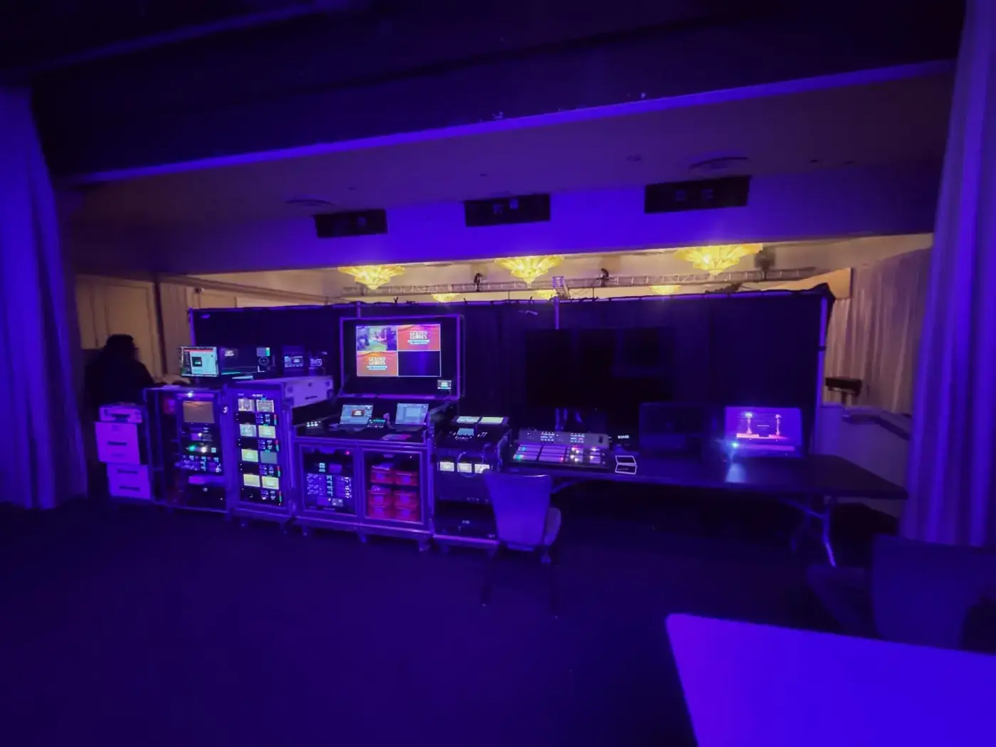 Flypack lit in violet at a venue