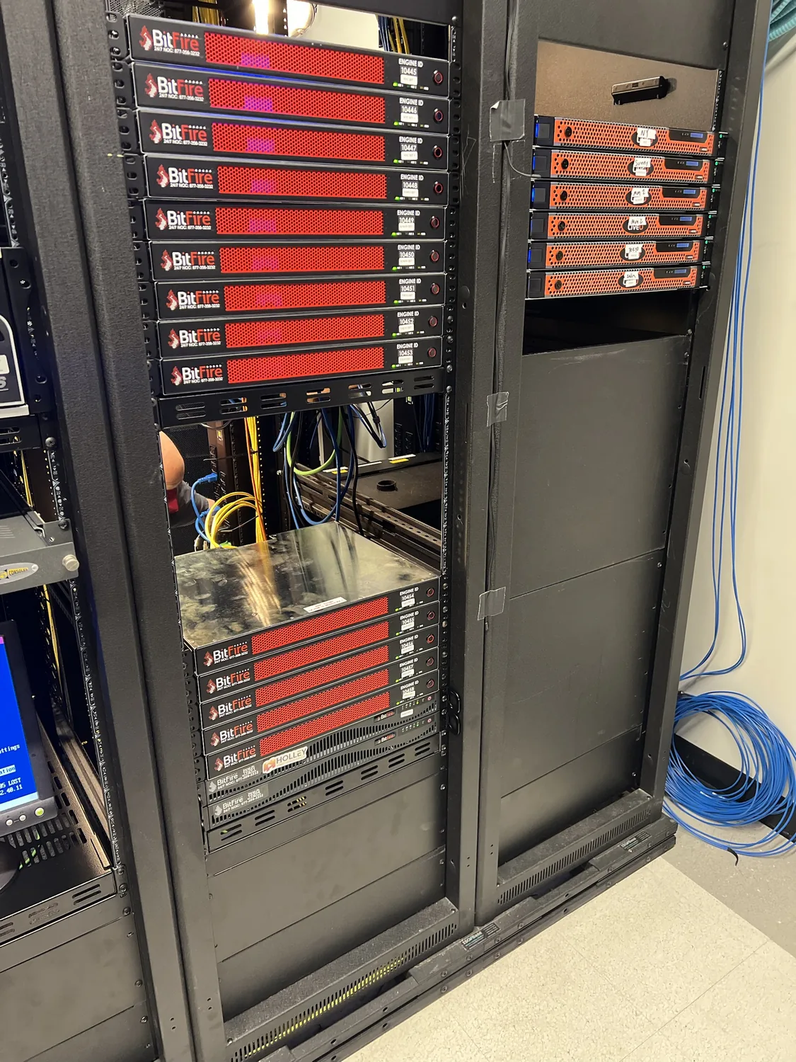 A rack full of red Bitfire IP video engines with a Holley Video sticker